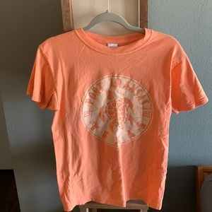 Mens size small Port Arkansas light orange graphic shirt